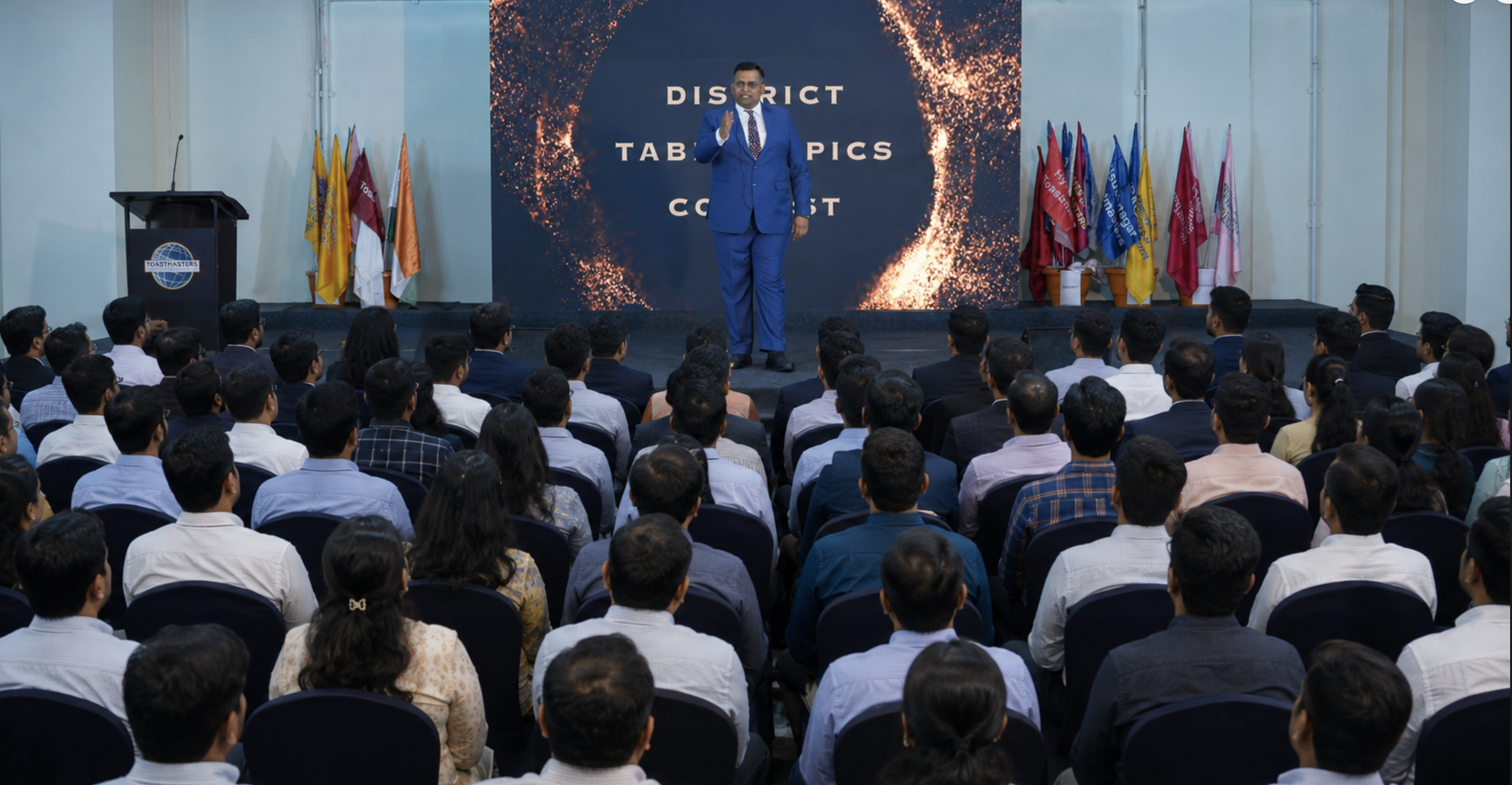Harsh Singhal commanding a full stage — Toastmasters District contest